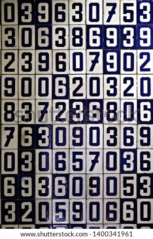 rows of tiles with numbers arranged randomly