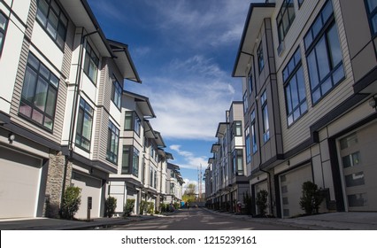 Rows of townhomes side by side. External facade of a row of colorful modern urban townhouses. brand new houses just after construction on real estate market