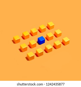 Rows of yellow cubes on yellow background and among them blue. Minimal style. Symbolic concept of conformism-non-conformism, adaptation and disagreement - Shutterstock ID 1242435877