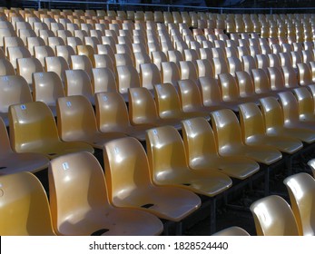 Rows Of Yellow Stadium Seats