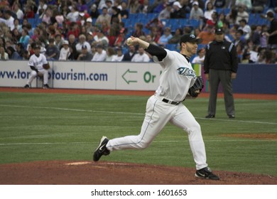 Roy Halladay Steps Off The Mound To Deliver His Pitch