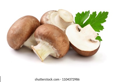 Royal Brown champignon with half and parsley leaf isolated on white background - Shutterstock ID 1104372986