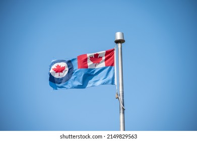 Royal Canadian Air Force (RCAF) Flag On Blue Sky.