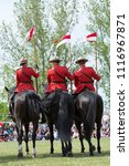 Royal Canadian Mountain Police parade with horses. 