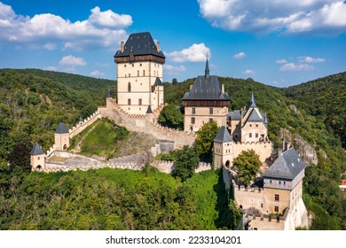 Royal Castle Karlstejn. Central Bohemia, Karlstejn village, Czechia. Aerial view to The Karlstejn castle. Royal palace founded King Charles IV. Amazing gothic monument in Czech Republic, Europe.