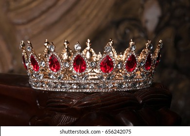 Royal crown with red gems. Ruby, garnet. Symbol of power and authority
