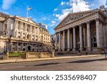 Royal Exchange and Bank of England buildings in City of London, UK (translation "founded in thirteenth year of Queen Elizabeth, and restored in eighth of Queen Victoria")