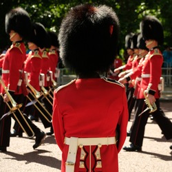 Royal Guards Taking Part In The Traditional Trooping The Colour Military Ceremony In London  On A Sunny Day
