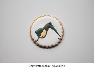 Royal Icing Cookie With Happy Woman Doing Downward Dog Yoga Pose - Top View - Close Up