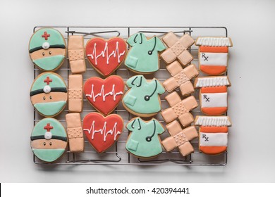 Royal Icing Sugar Cookies Decorated In Doctor Theme Arranged On Baking Rack - Top View