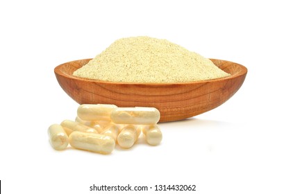 Royal Jelly Capsules And Bowl Isolated On A White Background