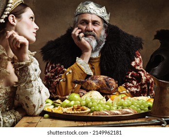 Royal Life Can Be Tedious.... A Bored Queen Sitting Alongside Her Husband At A Banquet.