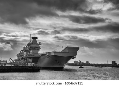 The Royal Navy Aircraft Carrier HMS Queen Elizabeth (RO8) Docked In Portsmouth, UK