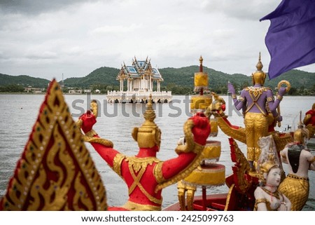 the Royal Pavillon on the Lake Khao Tao and a decoratet tradtional Longboat or dragon boat on the Lake Khao Tao reservoir south of City of Hua Hin.  Thailand, Hua Hin, November, 17, 2023