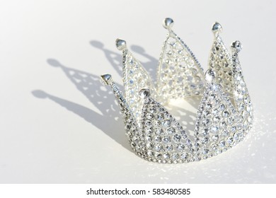 A Royal Silver Princess Crown With Shadow On  A Light Background Symbol For Royal House And Nobility