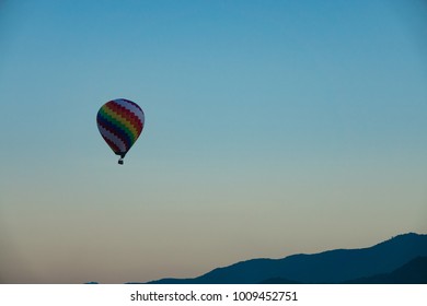 Royalty High Quality Free Stock Image Of Colorful Hot Air Balloons Flying On The Sky. Beautiful Background With Mountain And Village In Early Morning