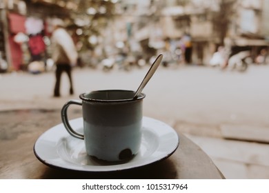 Royalty High Quality Free Stock Image Of  A Cup Of Coffee On Street Side In The Morning. Close Focus Of Cup With Copy Space For Text Or Advertising. Vintage Background