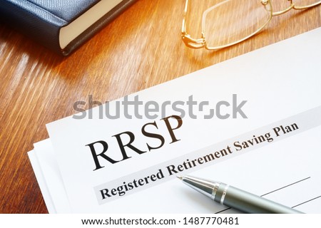 RRSP Registered Retirement Saving Plan documents on table.