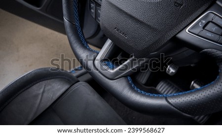 RS for rally sport on a steering wheel