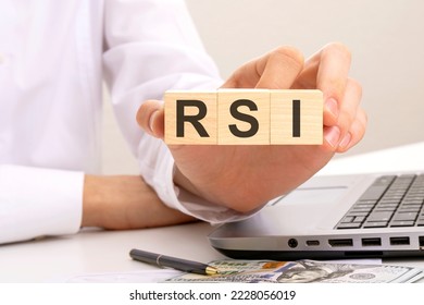 rsi - text on wooden cubes, on office table background. Relative Strength Index concept.