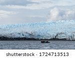 Rubber boat floating next to Pio XI Glacier