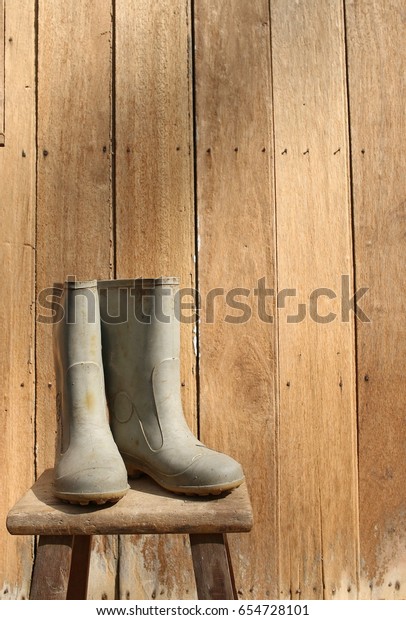 Rubber Boots Front Woods Wall Stock 