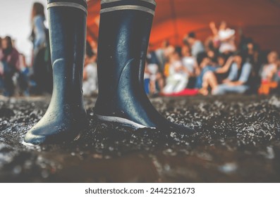Rubber Boots In The Mud At A Music Festival, With Copy Space
