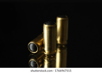 Rubber Bullets On Mirror Background. Self Defense Weapon