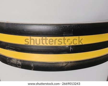 Rubber corner guard.
Rubber corner protector or wall angle protector safety infrastructure.
Black and yellow corner guards on a concrete pillar indoor parking garage.
Rubber bumper on Car parking.