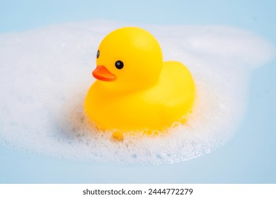 Rubber duck covered in soap foam