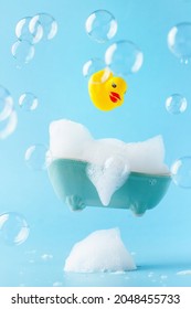 A Rubber Duck Flies Into A Bath Of Foam. Spa Concept. Global Handwashing Day