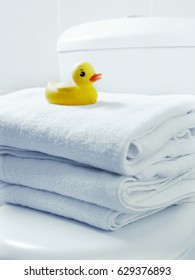 Rubber duck on a stack of towels 