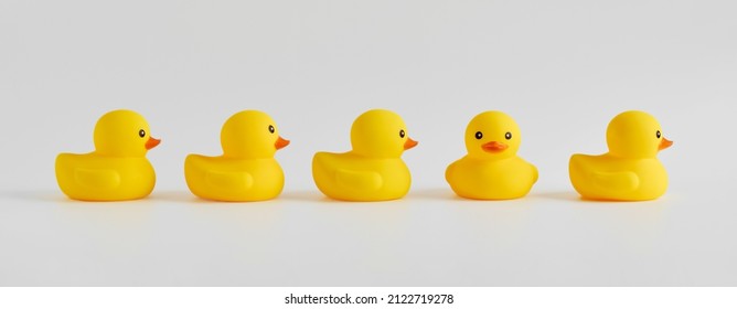 Rubber duck stands out from the crowd. Diversity, individuality, difference, minority or independence in business concept. - Shutterstock ID 2122719278
