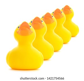 Rubber Ducks In A Row Isolated On A White Background.