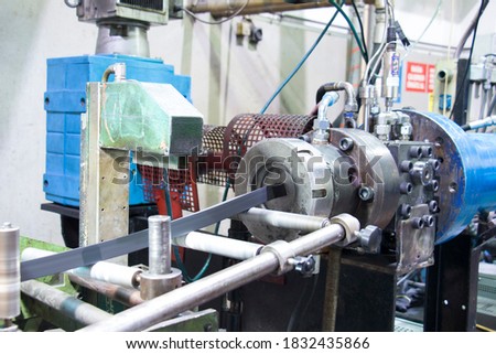 Rubber extruder is producing rubber profile