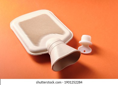 Rubber Heating Pad On Orange Background, Top View