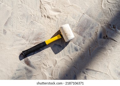 Rubber Mallet On Sandy Ground. Construction Of A Footpath. Space