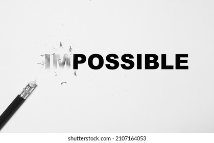 Rubber on pencil rub wording form impossible to possible for positive thinking mindset concept. - Shutterstock ID 2107164053