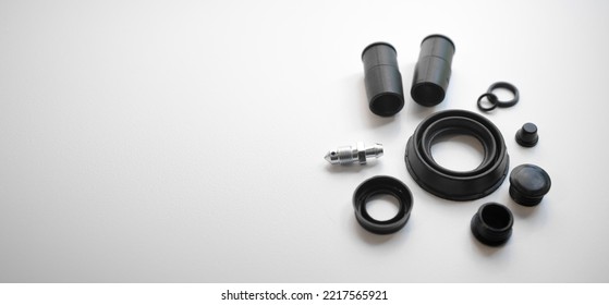 Rubber Parts For The Car Brake System On White Isolate. Replacement Of Sealing Rubber Bands In The Brakes Of The Machine.Repair Kit On A White Background.