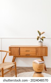 Rubber Plant On A Wooden Sideboard Table