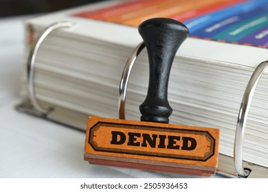 Rubber stamp with word Denied on it. Being turned down rejected refused for a loan or application.