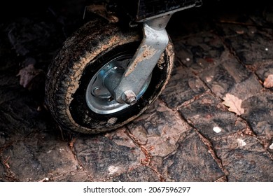 A Rubber Tire From A Car Covered In Mud