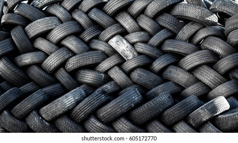 Rubber Tire Recycling. Old Used Car Tires  At A Junkyard In Piles Waiting For Recycle.