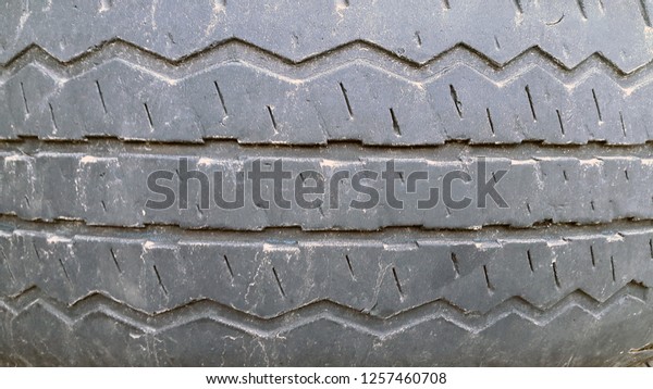 Rubber. Tire. Rubber surface. Wheel
protector. Tire tread photo. Car wheel protector close
up