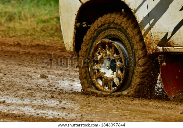Rubber tire\
wheel damage on muddy off road\
outdoor.
