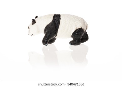 A Rubber(plastic) Toy Of Panda Bear Side View Isolated White.