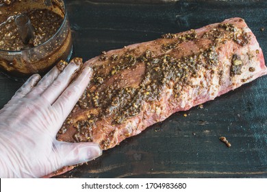 Rubbing Jerk Marinade Onto Pork Ribs: Rubbing A Spicy Paste Onto A Raw Rack Of Baby Back Ribs