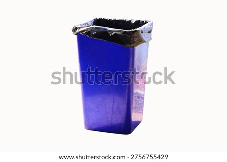 Rubbish bin garbage square shape blue with black plastic bag isolated on white background. Waste collection equipment in park. Old dirty trash cans plastic.