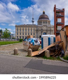 Rubbish of a construction site in the foreground . THE NEWLY RECONSTRUCTED Berlin City Palace is in the BACKGROUND. 