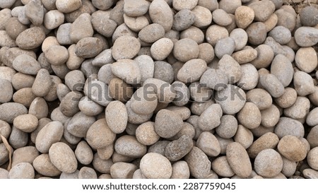 Rubble or gravel background, construction material. Exterior garden floor. Gravel pebble stone texture seamless texture for background or backdrop.